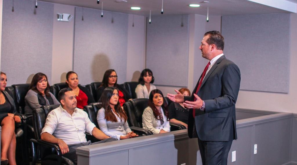 a lawyer talking to members of the jury