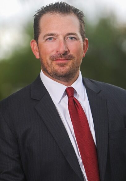 A Portrait of Attorney Sean Claggett in a Blurry Background